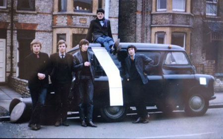A picture of the band taken by Syd Barrett in 1966 featuring Bob Klose, left, Richard Wright, Roger Waters, centre, Chris Dennis, on top of the car, and Nick Mason.