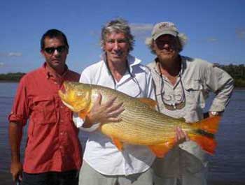 Roger Goes Fishing. Snapped some distance from Buenos Aires. Roger is holding a Dorado fish, understood to weigh more than 20 Kg.