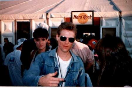 Bryan Adams backstage at the Hard Rock Tent. This was taken before the show, where many of the band members and special guests were wondering around and having a few cold ones at the Hard Rock. Tom's passes didn't give them clearance to get in, so they hung outside. The woman glaring over his shoulder is understood to be Bryan's manager. She apparently wasn't too happy that Bryan was actually MINGLING with the fans! Tom said that Bryan was "very cool" and in his opinion " a highlight of the concert".