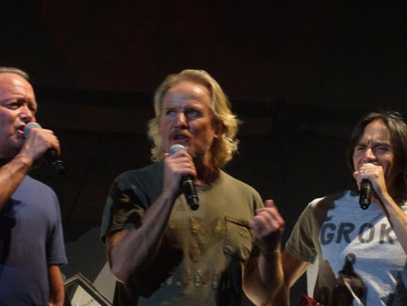 Pat, Mark and Kipp Lennon performing "Outside The Wall"  (photo by Simon Wimpenny)