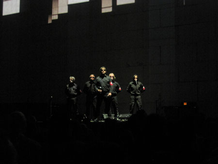 Robbie Wyckoff and the male chorus (photo by Robert Perry)