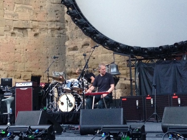 Phil Taylor (David's guitar tech) checks the equipment before the show gets underway 