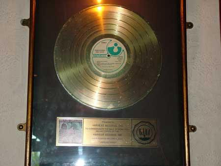 The inscription on this Gold Record that was sent in by Frank Parrish reads: Presented to HARVEST RECORDS.INC To commemorate the sale of more than 500,000 copies of the HARVEST RECORDS.INC Long Playing Record Album "Ummagumma" (Pic taken April 2004. Thanks Frank)