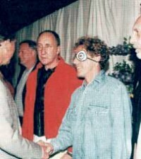 A grinning David Gilmour (3rd left) meets Prince Charles at the Princes Trust Show in 1996