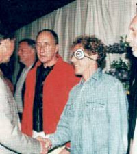 A grinning David Gilmour (3rd left) meets Prince Charles at the Princes Trust Show in 1996