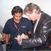 Roger signs The Wall LP booklet